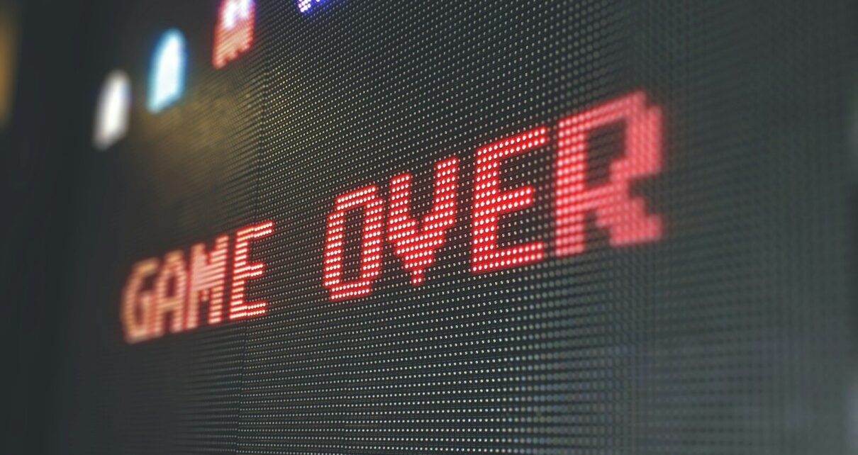 A digital screen displaying the words GAME OVER in red pixelated letters