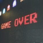 A digital screen displaying the words GAME OVER in red pixelated letters